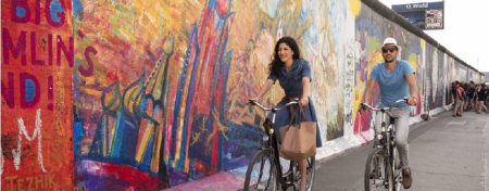 riding the bike along the Berlin wall